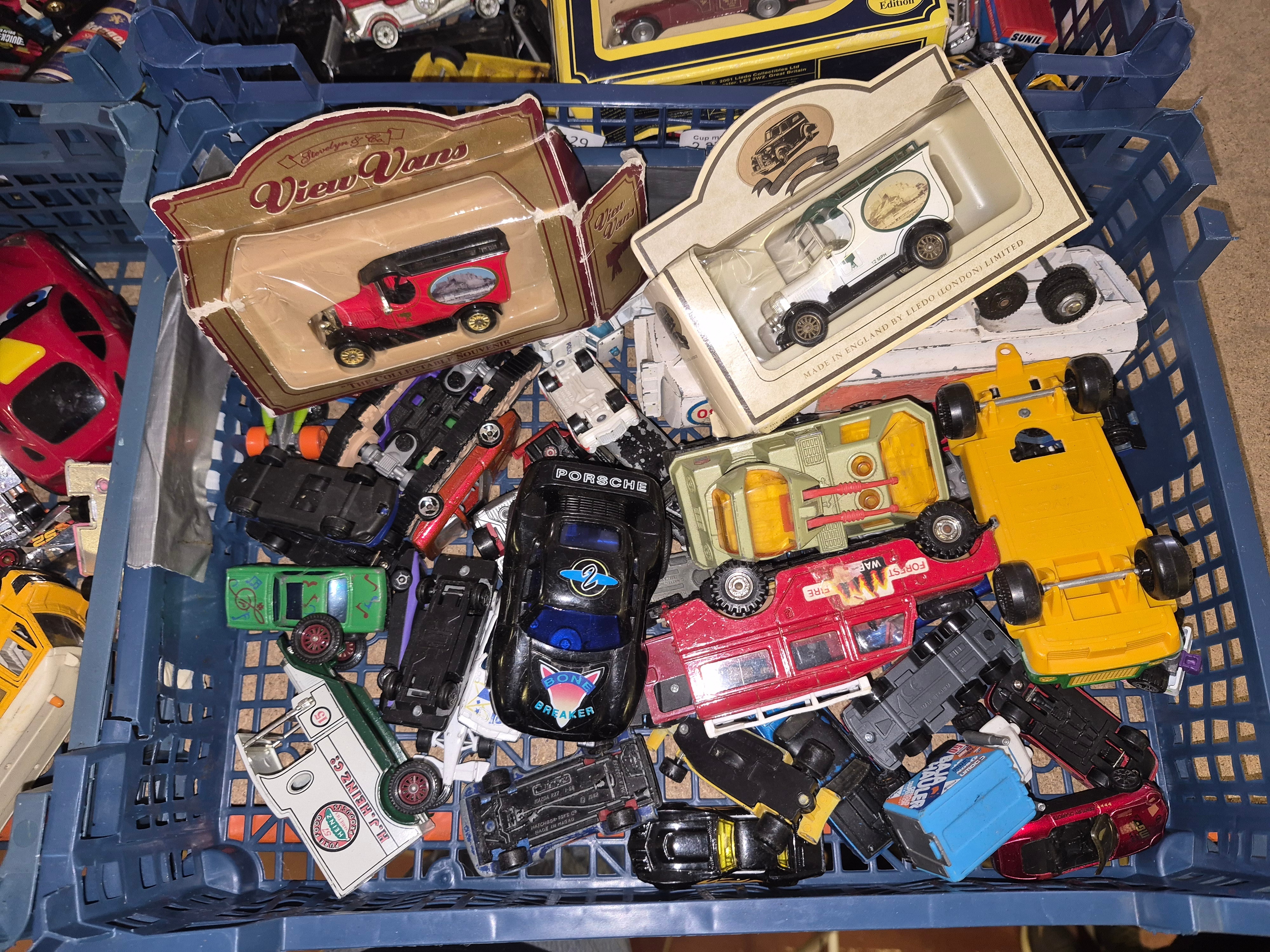 Crate of Miscellaneous Die-cast and Plastic Toy Vehicles Including Lledo and View Vans