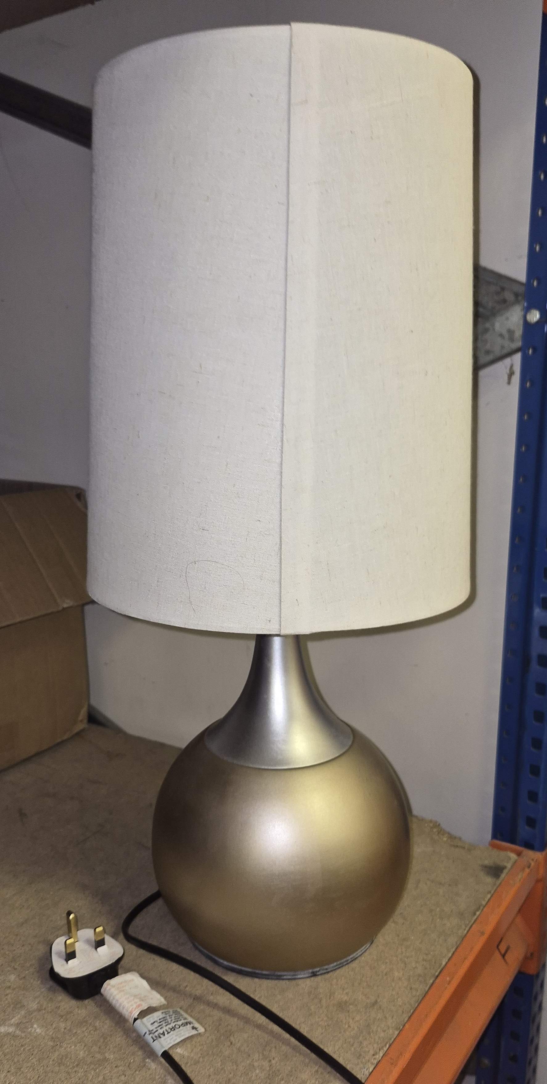 A Modern Metallic Base Table Lamp with Fabric Drum Shade