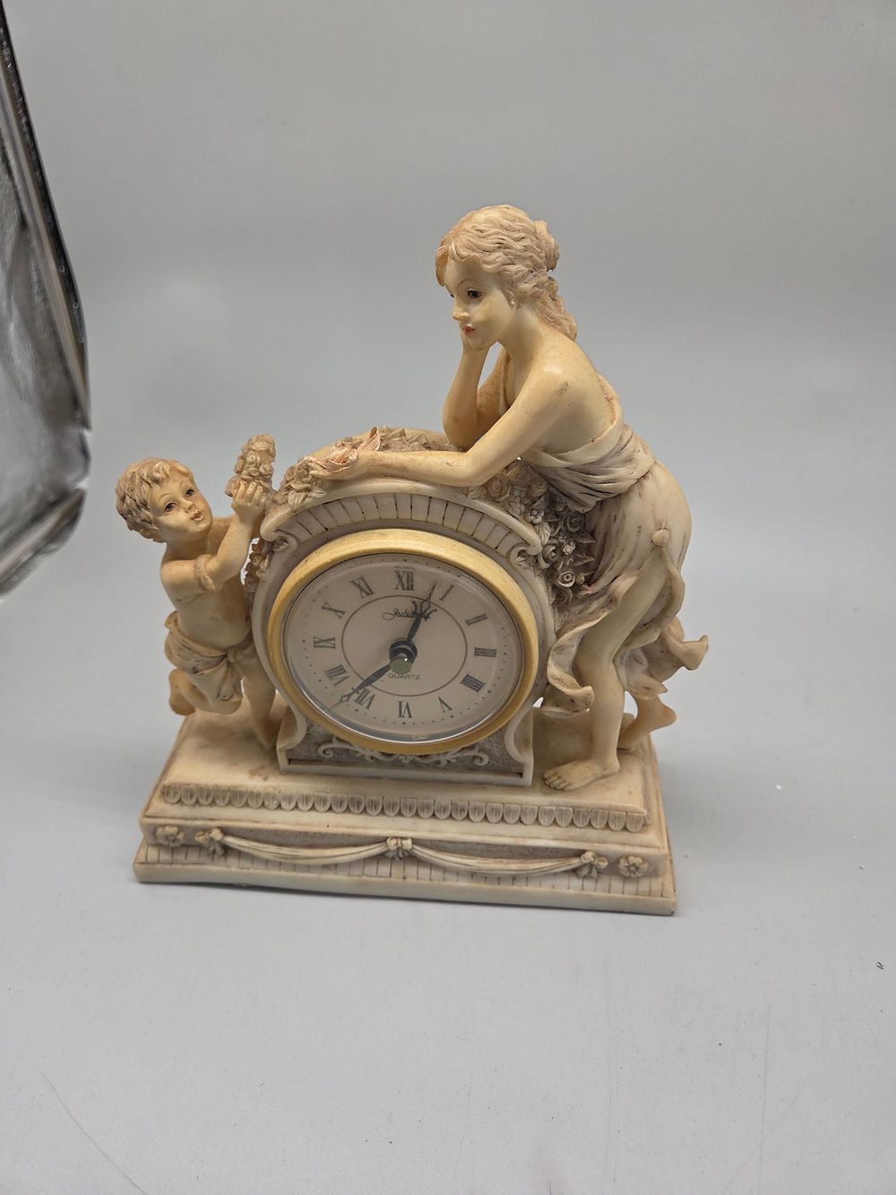 Lot 200 – Jubilee Figural Mantel Clock Featuring Classical Woman and Cherub in working order