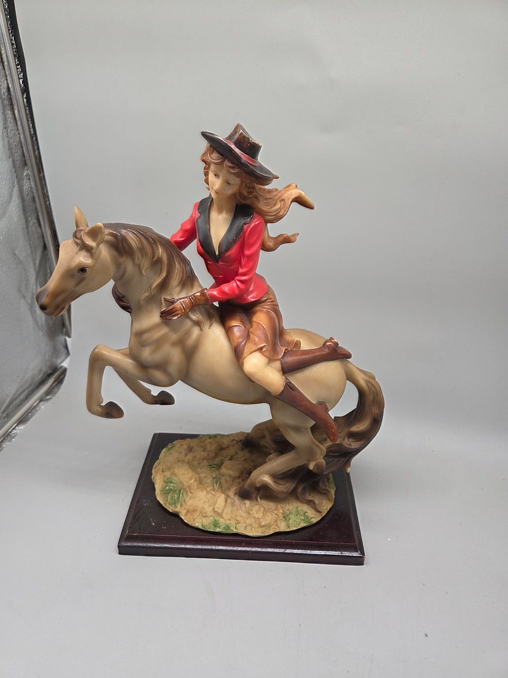 Lot 201 – Cowgirl Bronco Rider Resin Figurine