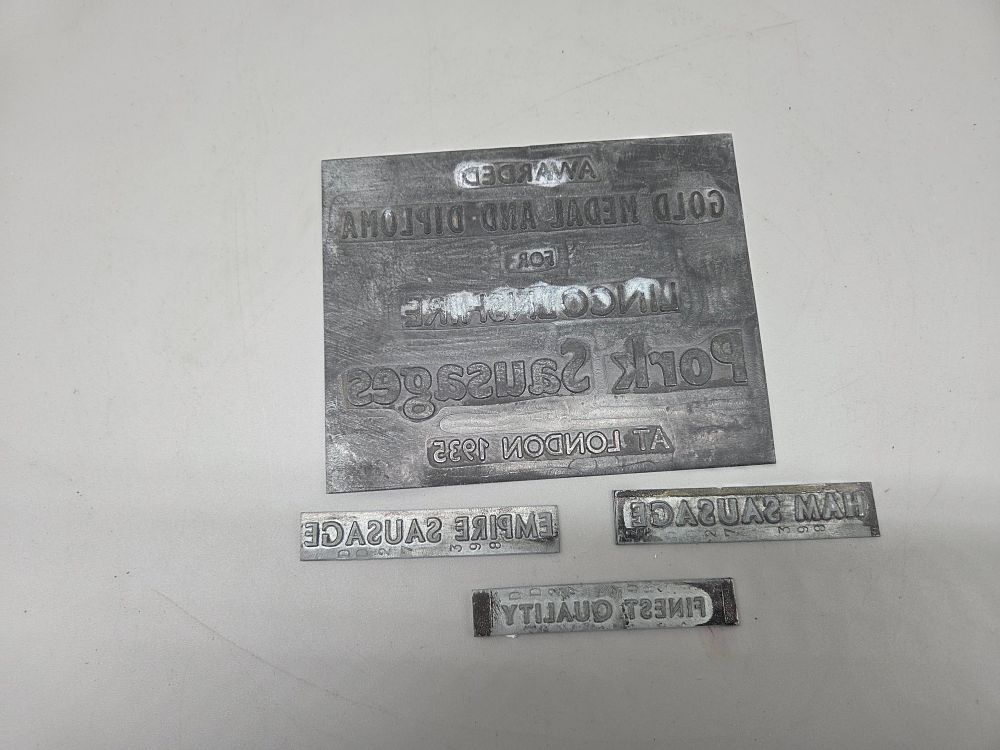 Lot 207 – A Selection of Vintage Industrial Printing Blocks Including Lincolnshire Pork Sausages