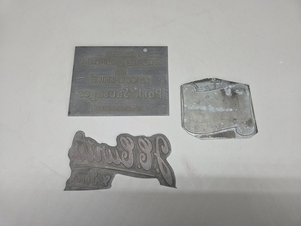 Lot 208 – A Selection of Vintage Metal Printing Blocks Including Lincolnshire Pork Sausages 1932 Award