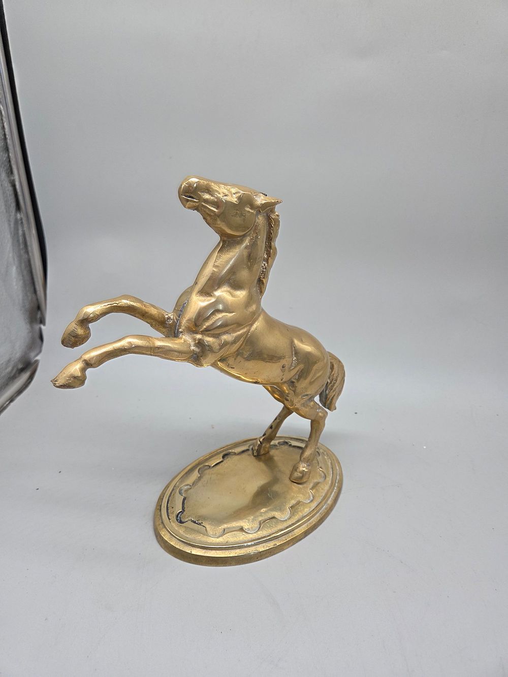 Lot 217 – A Solid Brass Model of a Galloping Horse