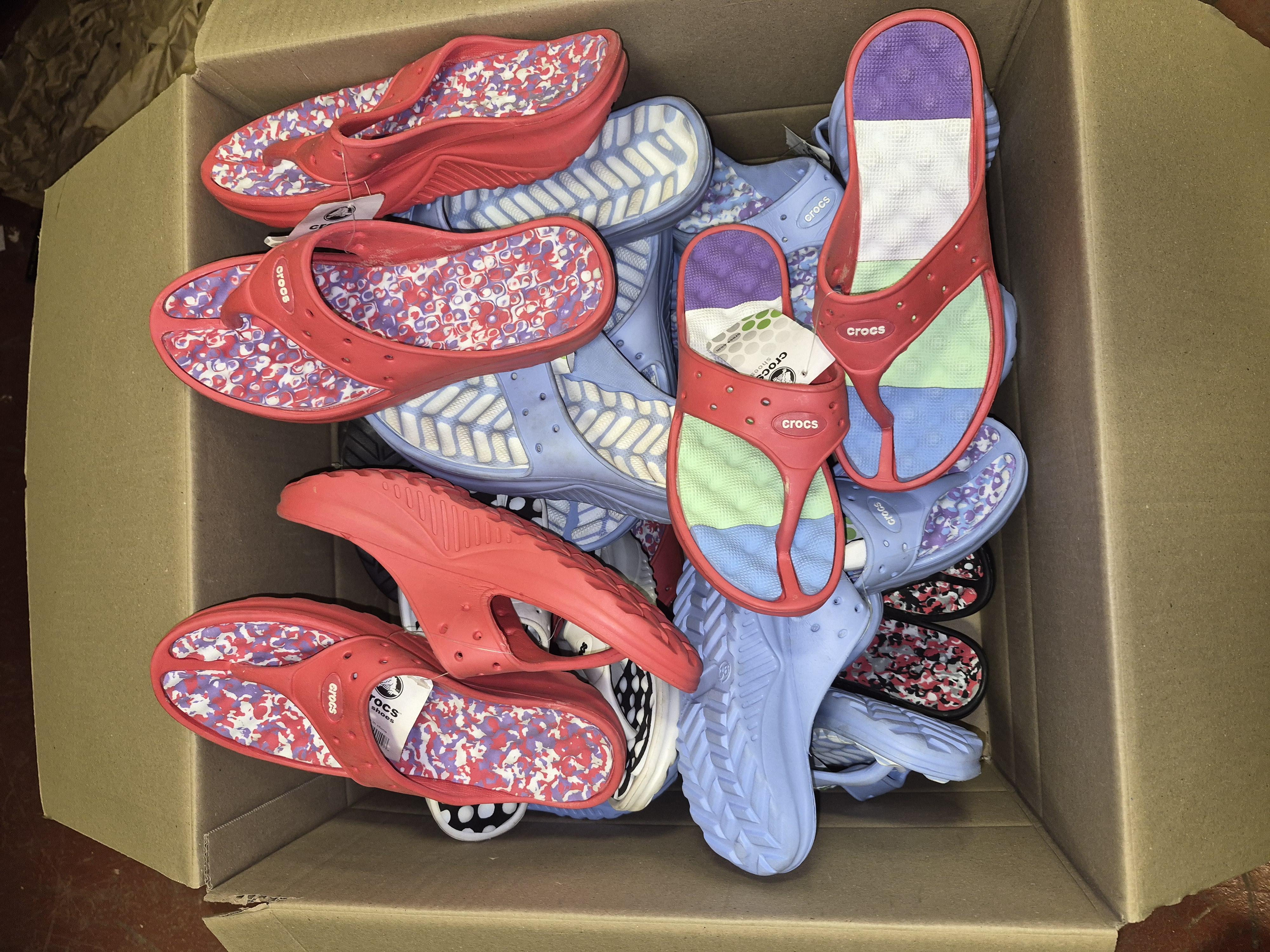 Box of New Crocs Flip-Flops Various Sizes