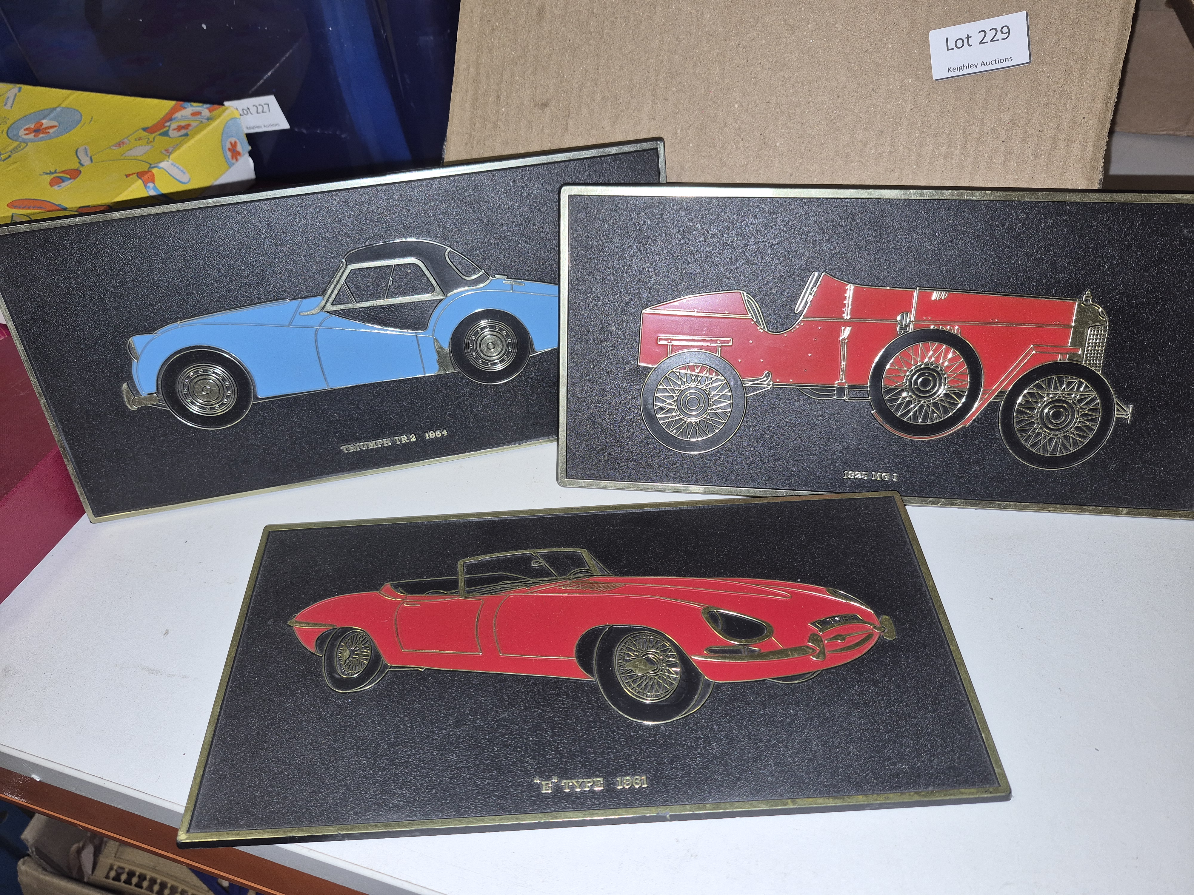 A Selection of Unipart Leyland Cars Framed Relief Wall Plaques Including Jaguar E-Type