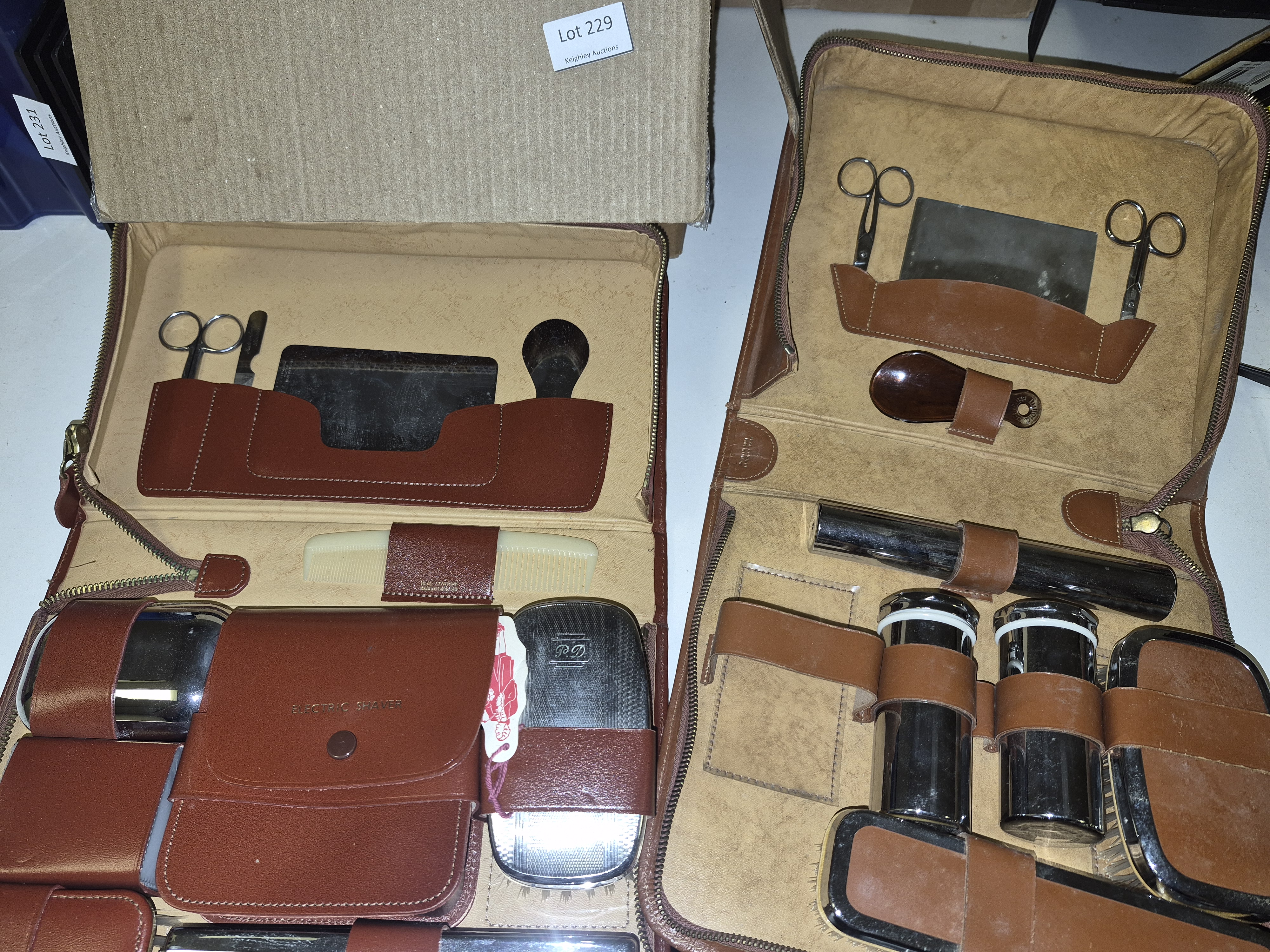 A Selection of Vintage Leather Travel Grooming Sets