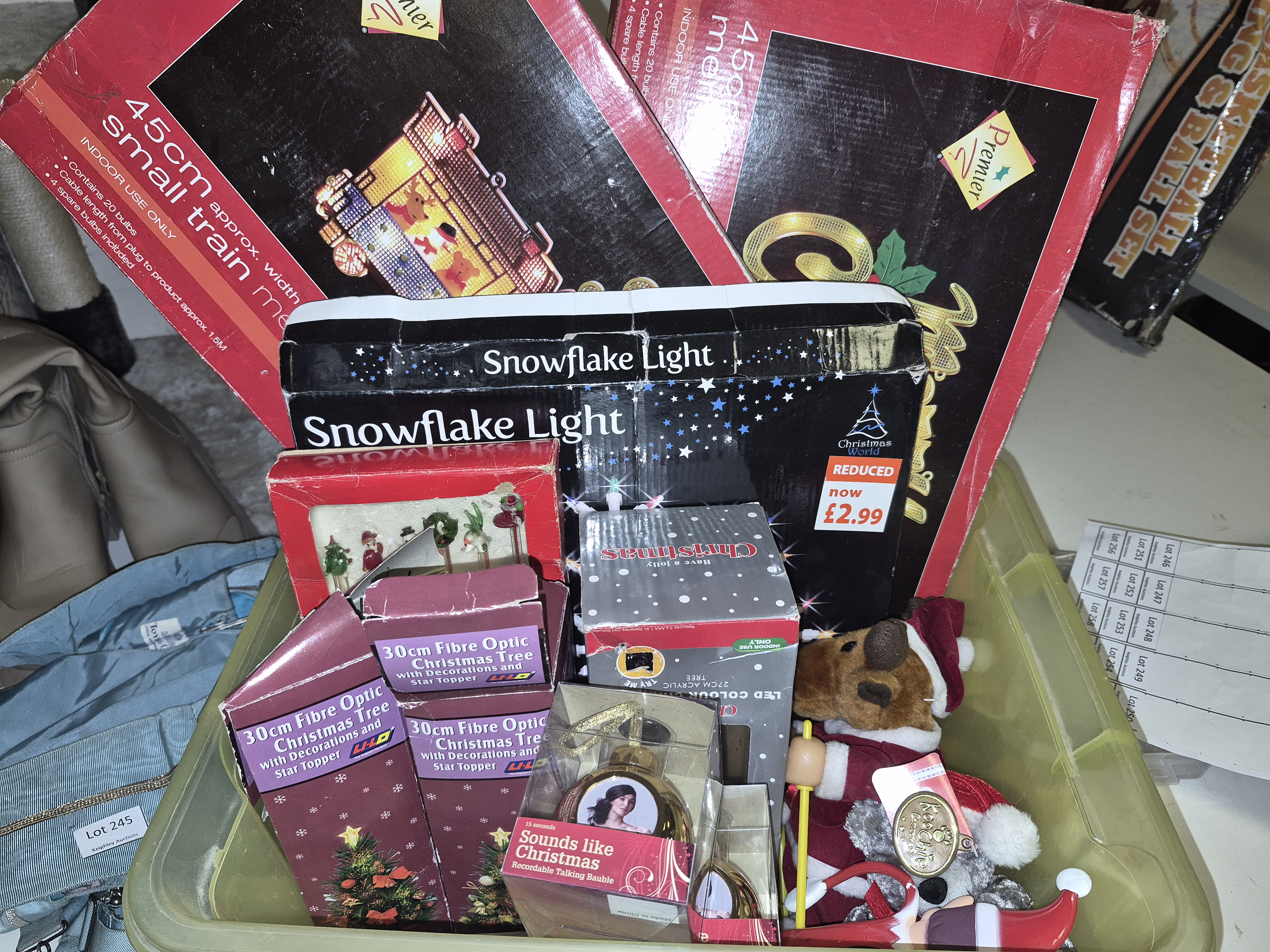 A Box of Christmas Decorations and Lighting Including Premier and Snowflake Light