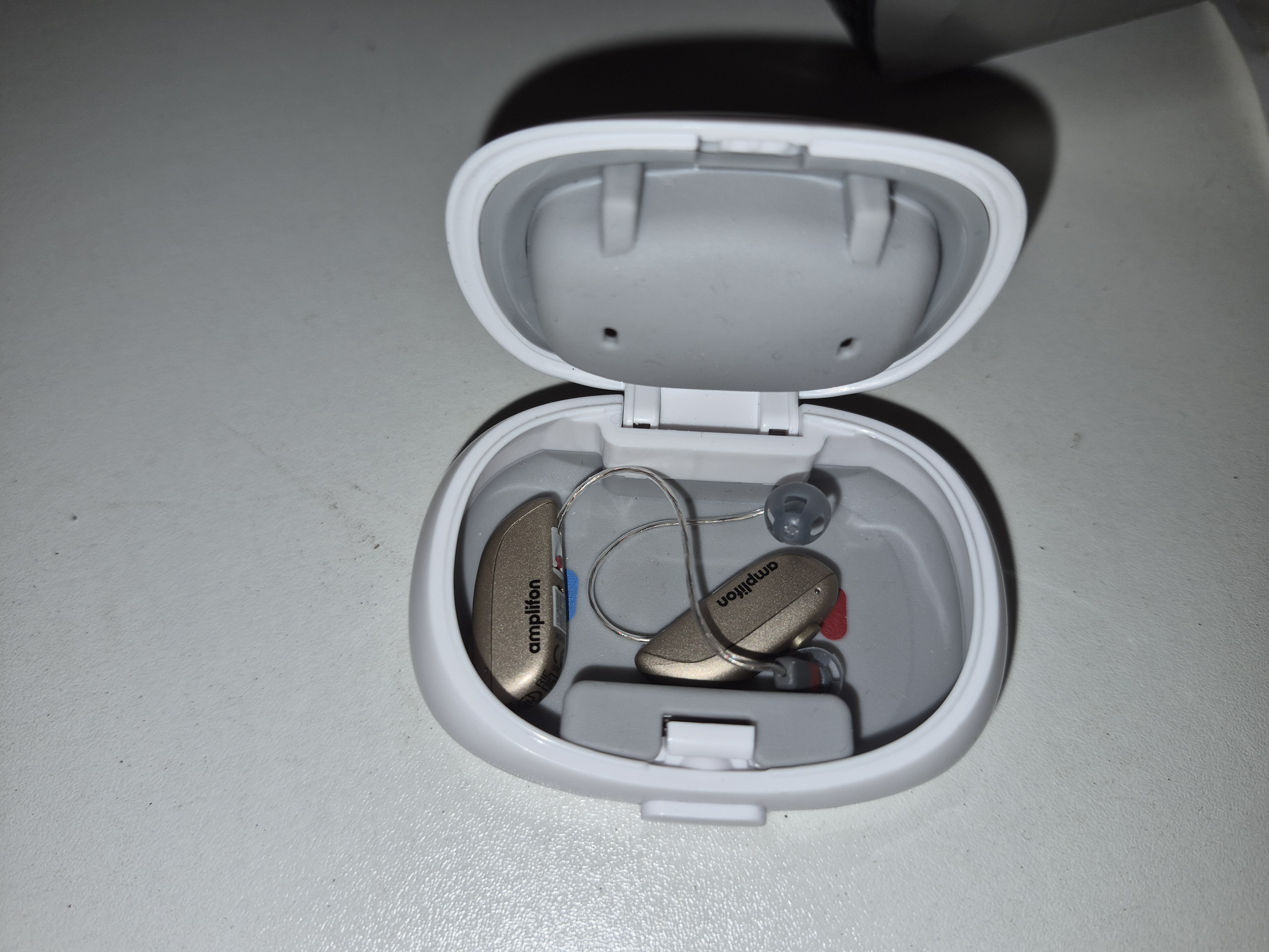 A Pair of Amplifon Rechargeable Receiver In Canal Hearing Aids