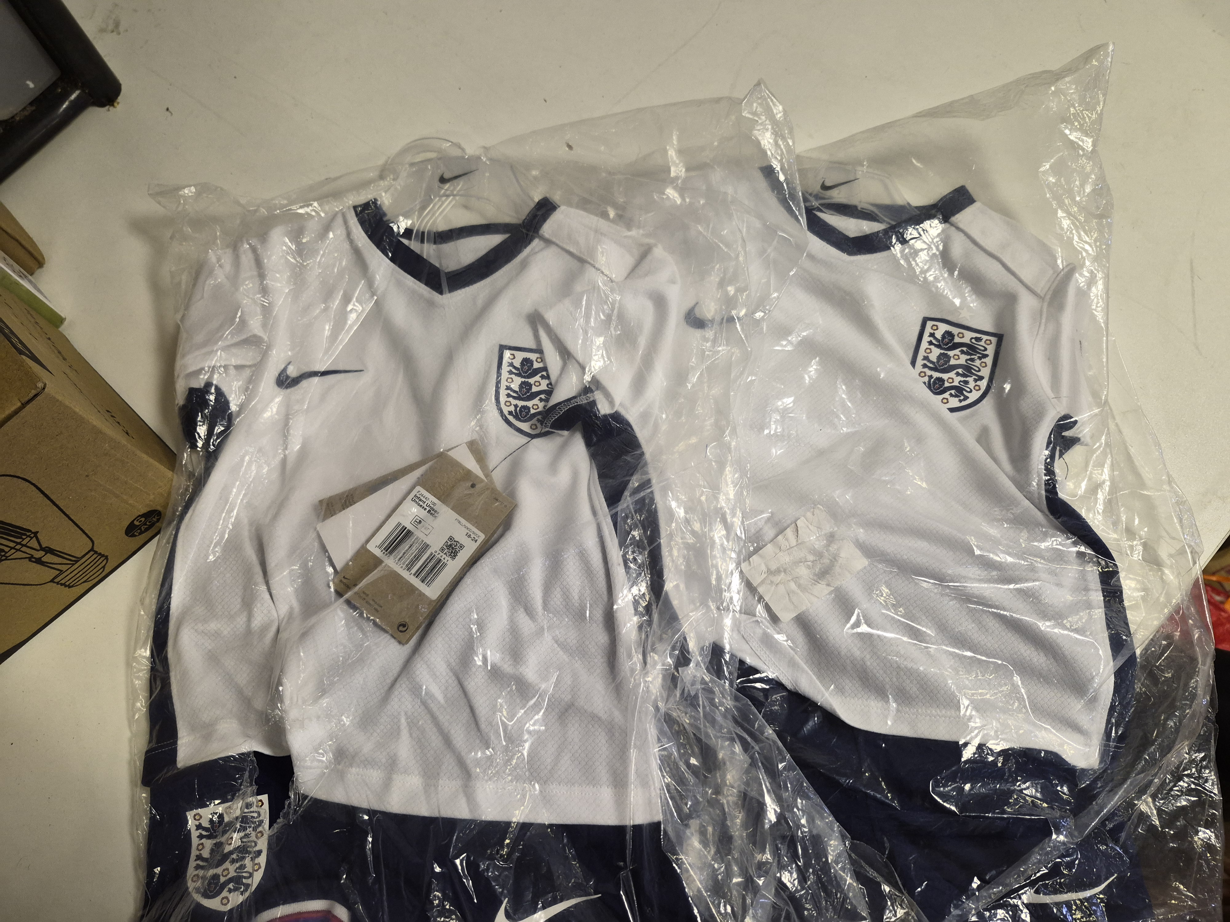 A Pair of Nike England National Team 2024 Home Kits size 18-24mnths