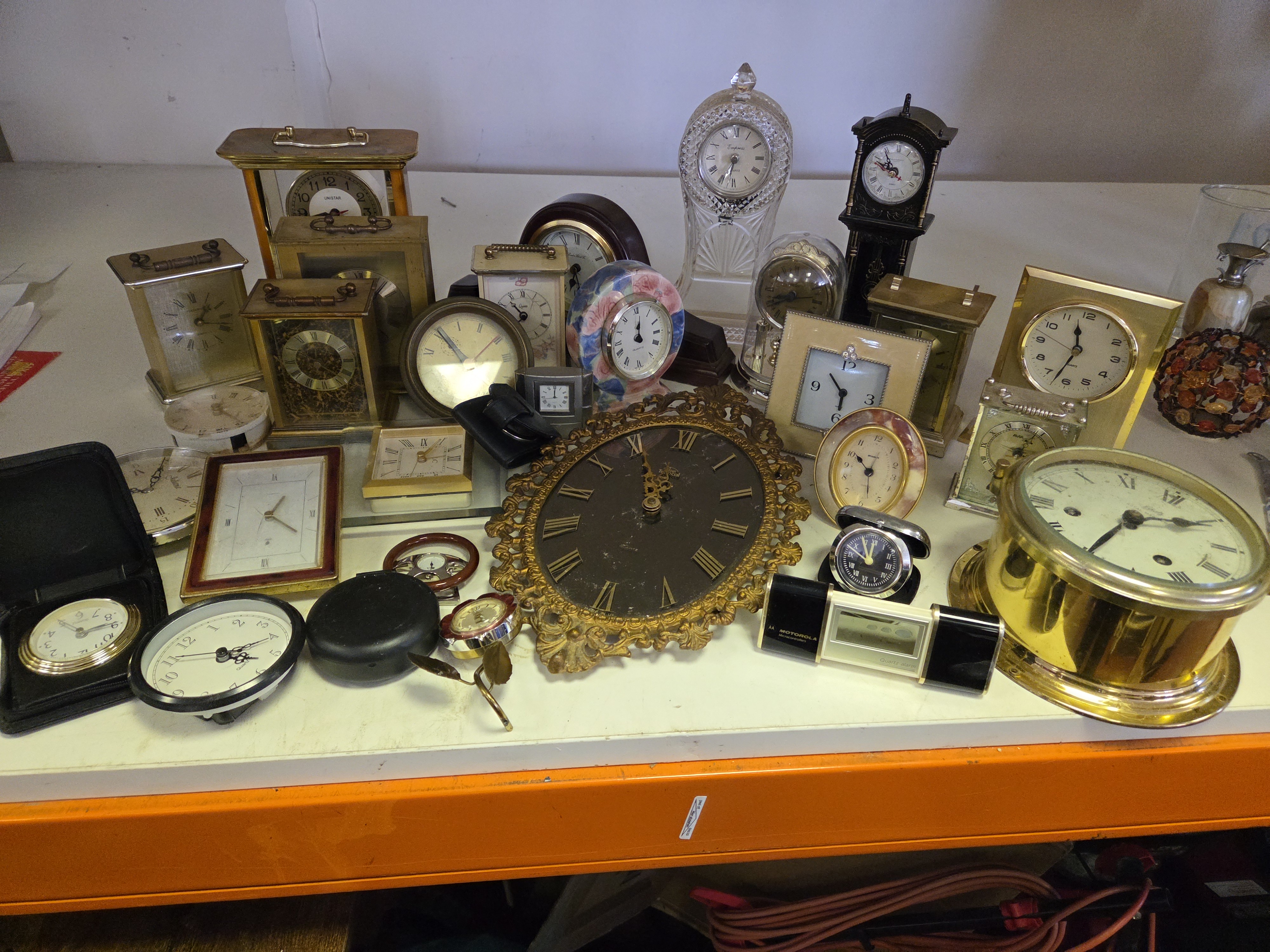 A Collection of Mantle and Carriage Clocks Including Empress Motorola and Unistar