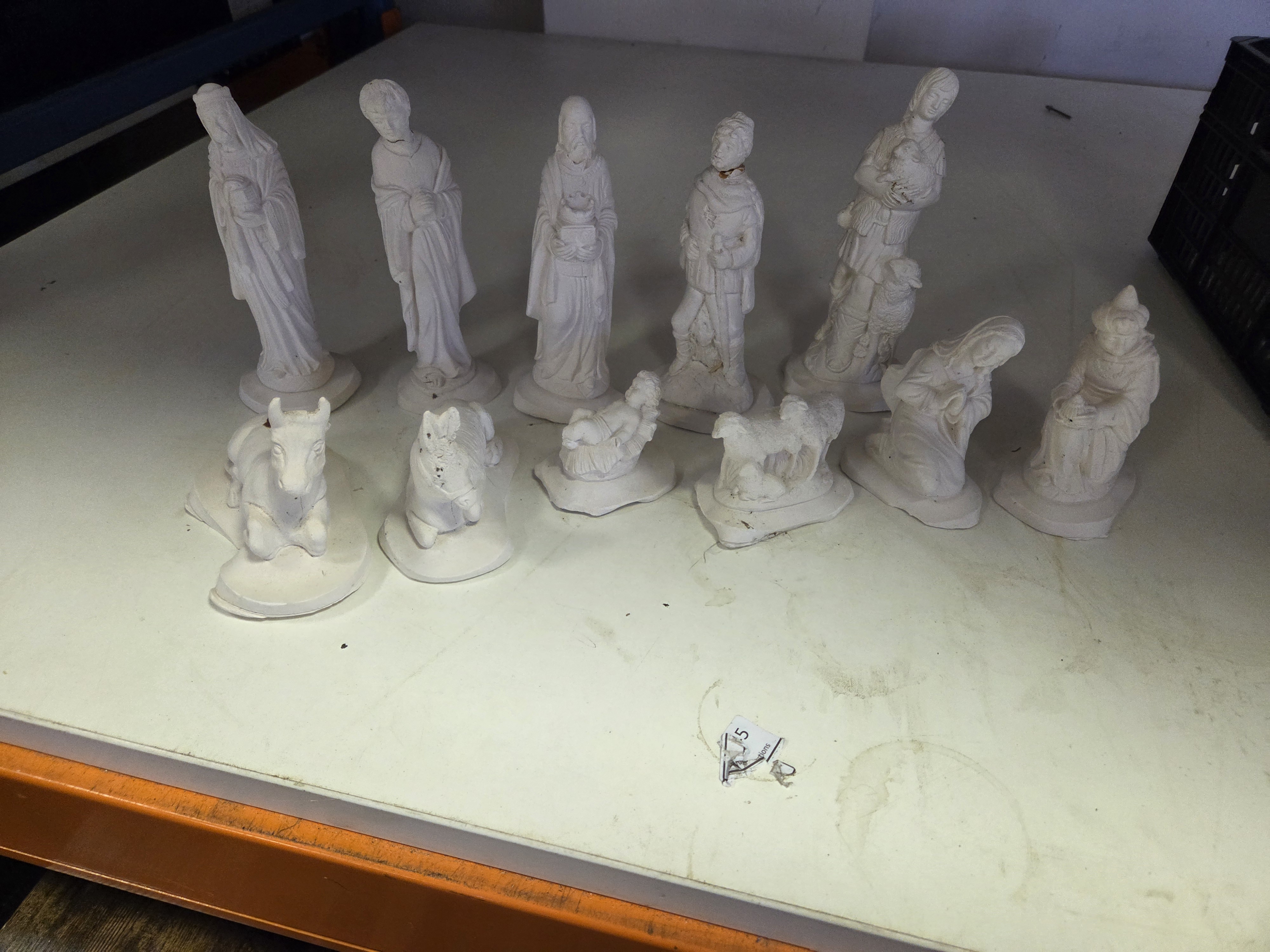 A Collection of Unpainted White Ceramic Nativity Figurines