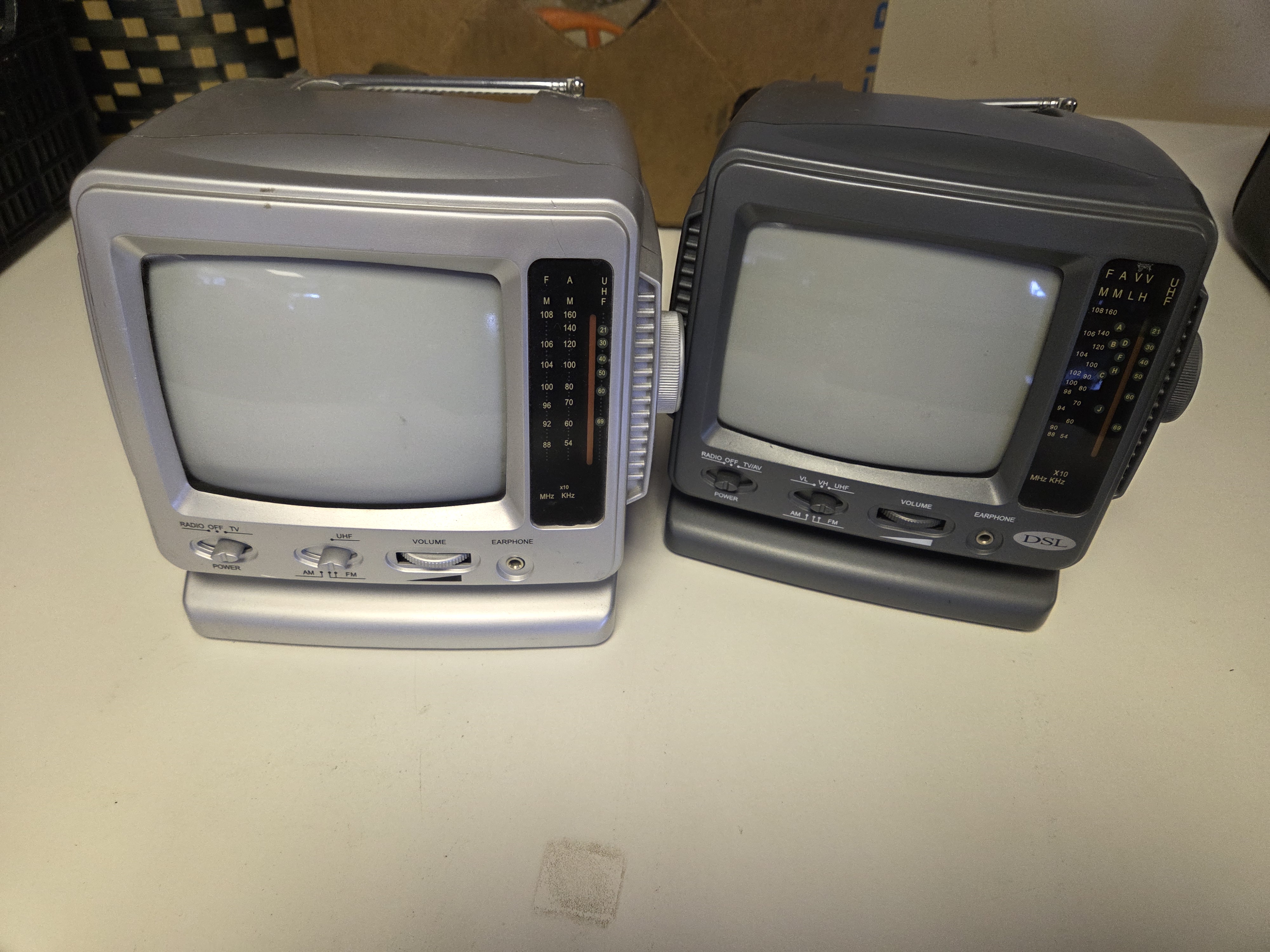 A Pair of Portable 5 Inch Black and White Televisions Including DSL