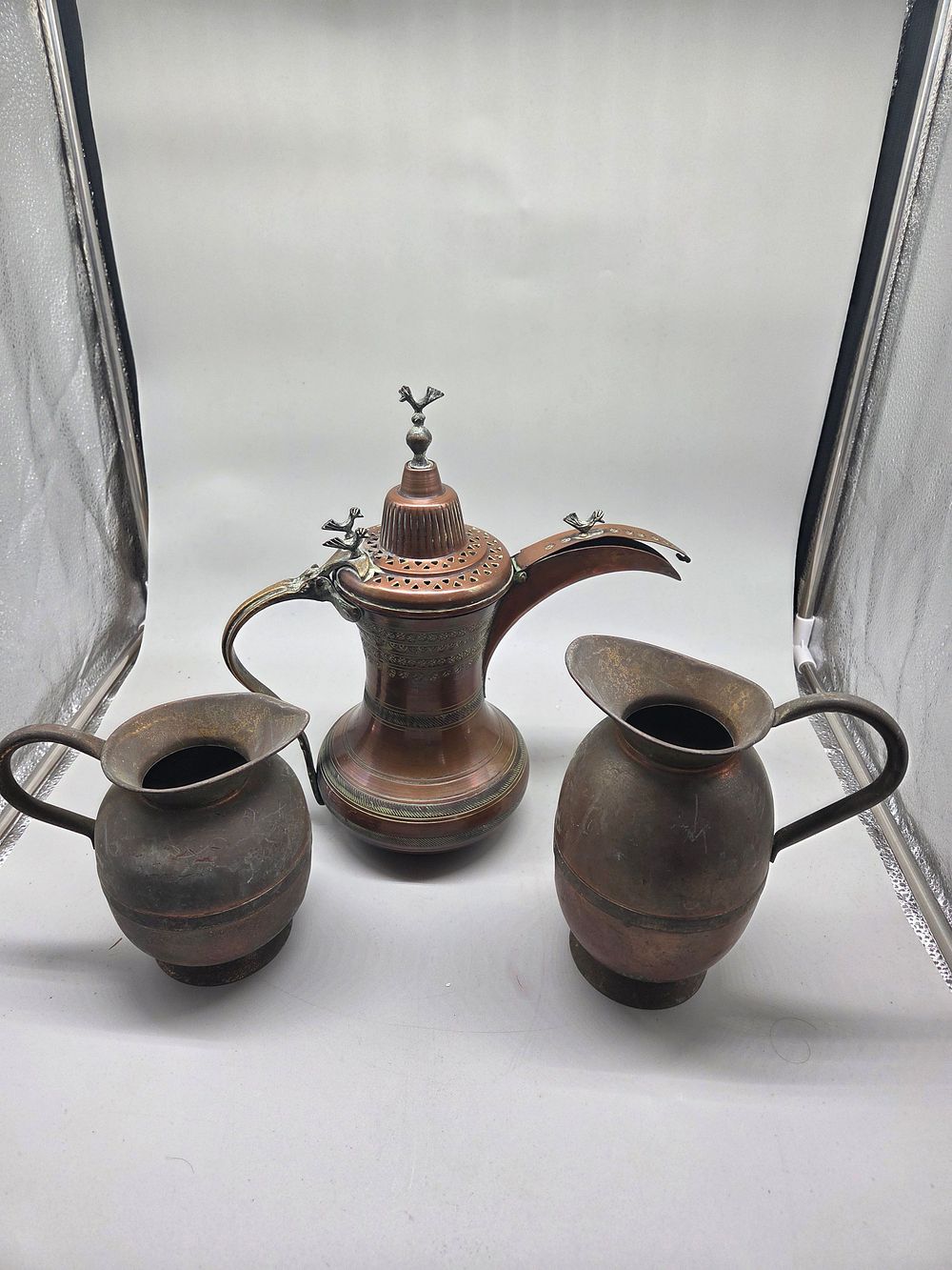 Lot 230 – A Selection of Decorative Copper Middle Eastern Metalware Including Dallah and Jugs