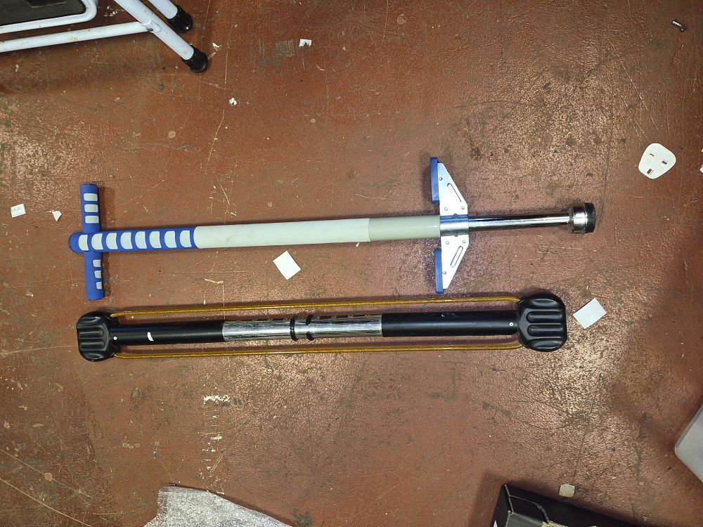 Lot 174 – A Pogo Stick and Resistance Band Bar