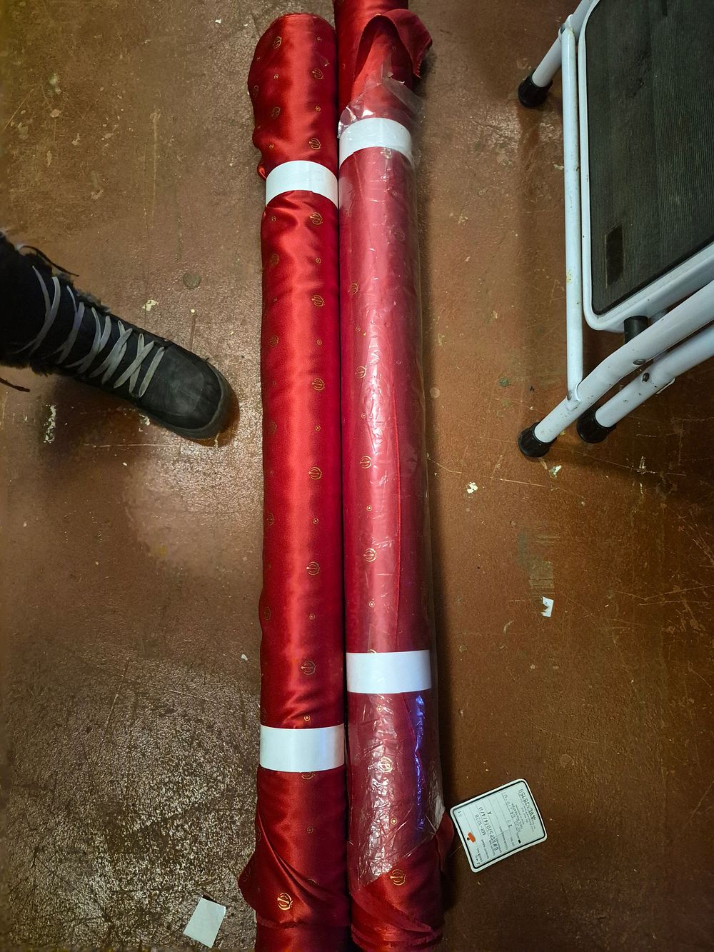 Lot 177 – Two Rolls of Japanese 100% Polyester Red Satin Fabric with Khanda Symbols (colour may differ slightly from image)
