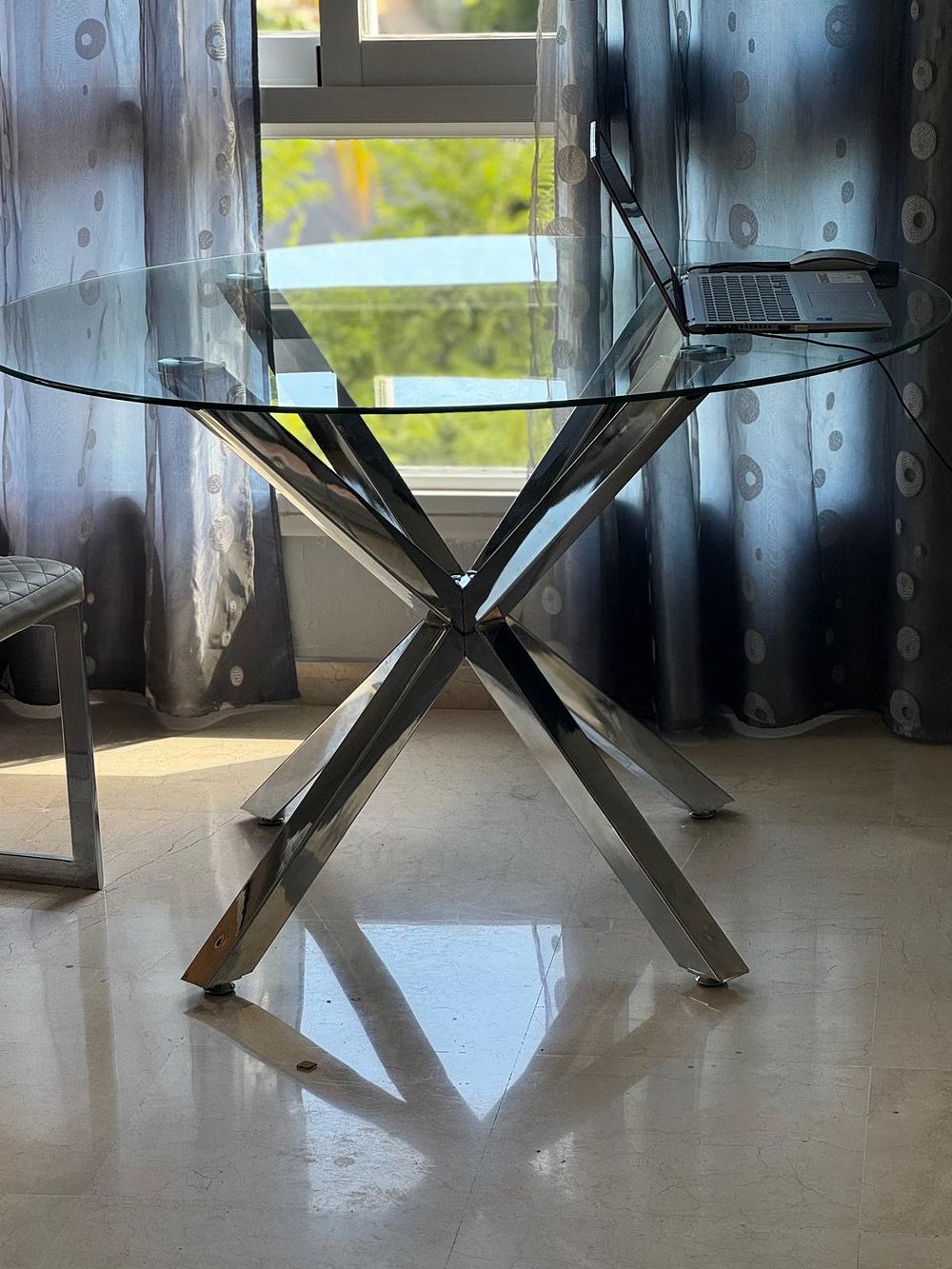 Lot 232 – Modern Circular Glass Top Dining Table and Four Cantilever Chairs