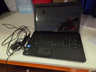 One Toshiba Satellite Laptop with AC Adapter