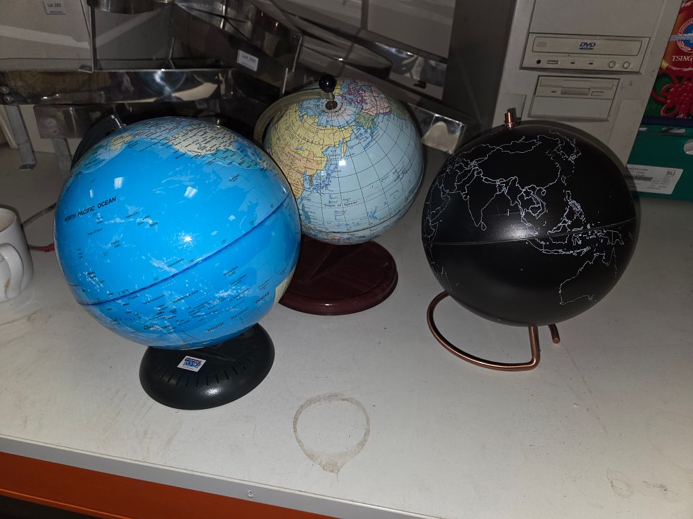 Lot 298 – Three Desktop World Globes including Modernist and Traditional Styles