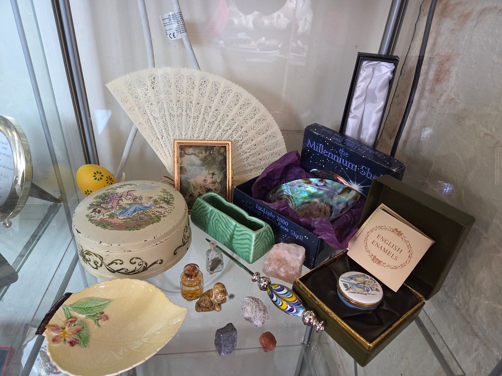 Lot 624 – A Collection of Decorative Items and Miniatures Including an English Enamels Pill Box and a Millennium Shell