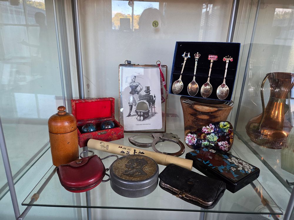 Lot 625 – An Assortment of Curios Including a Souvenir Spoon Set, Erotic Postcard, and Lacquerware