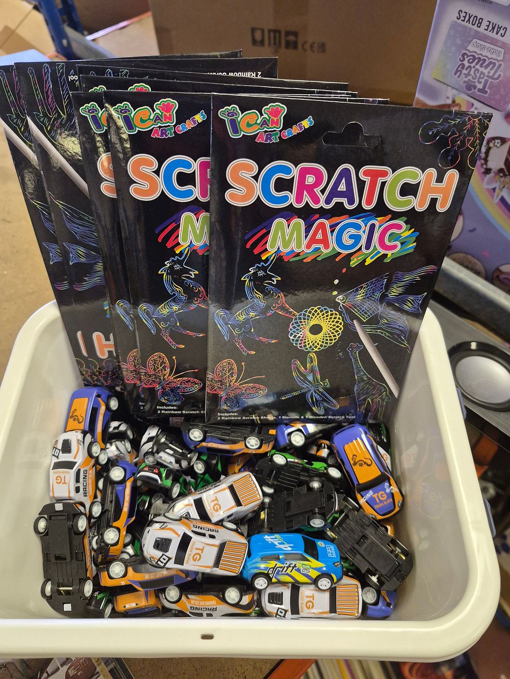 Lot 17 – A Collection of I Can Art Crafts Scratch Magic Activity Packs and Plastic Toy Racing Cars