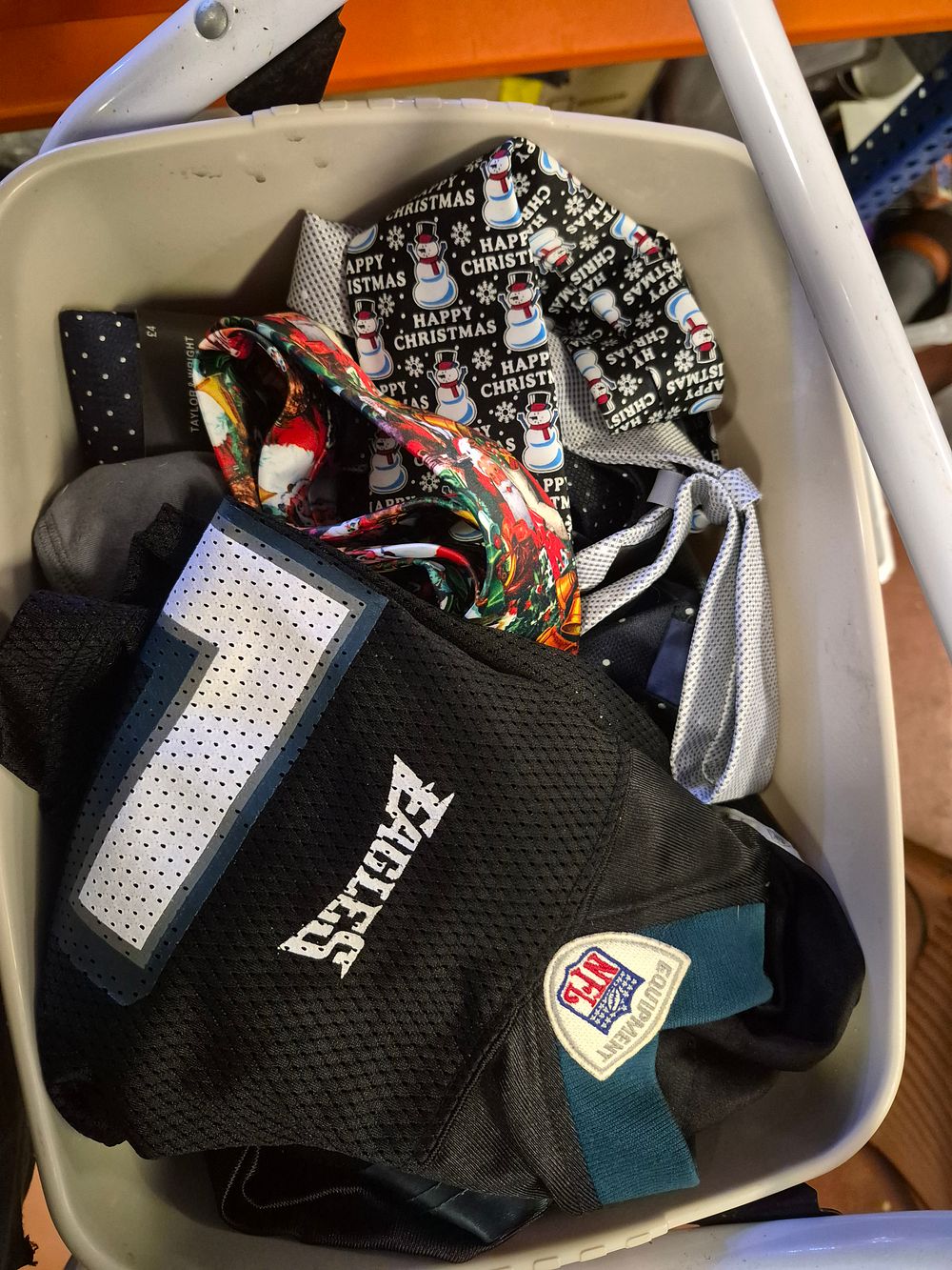 Lot 43 – An Assortment of Neckties and a Philadelphia Eagles NFL Jersey