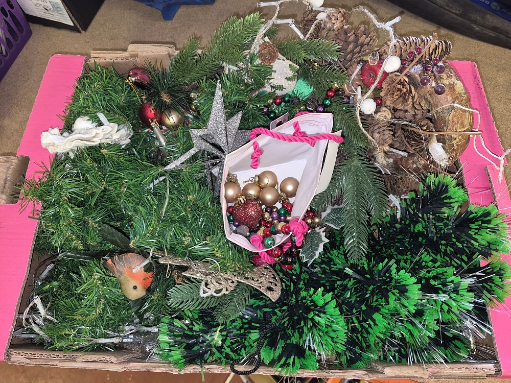 Lot 52 – An Assortment of Artificial Greenery and Christmas Decorations Including a Glitter Star Tree Topper