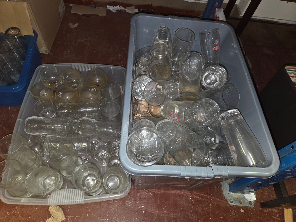 Lot 120 – Two Crates of Assorted Glassware Including Tsingtao Pilsner Glasses and Leffe Chalices