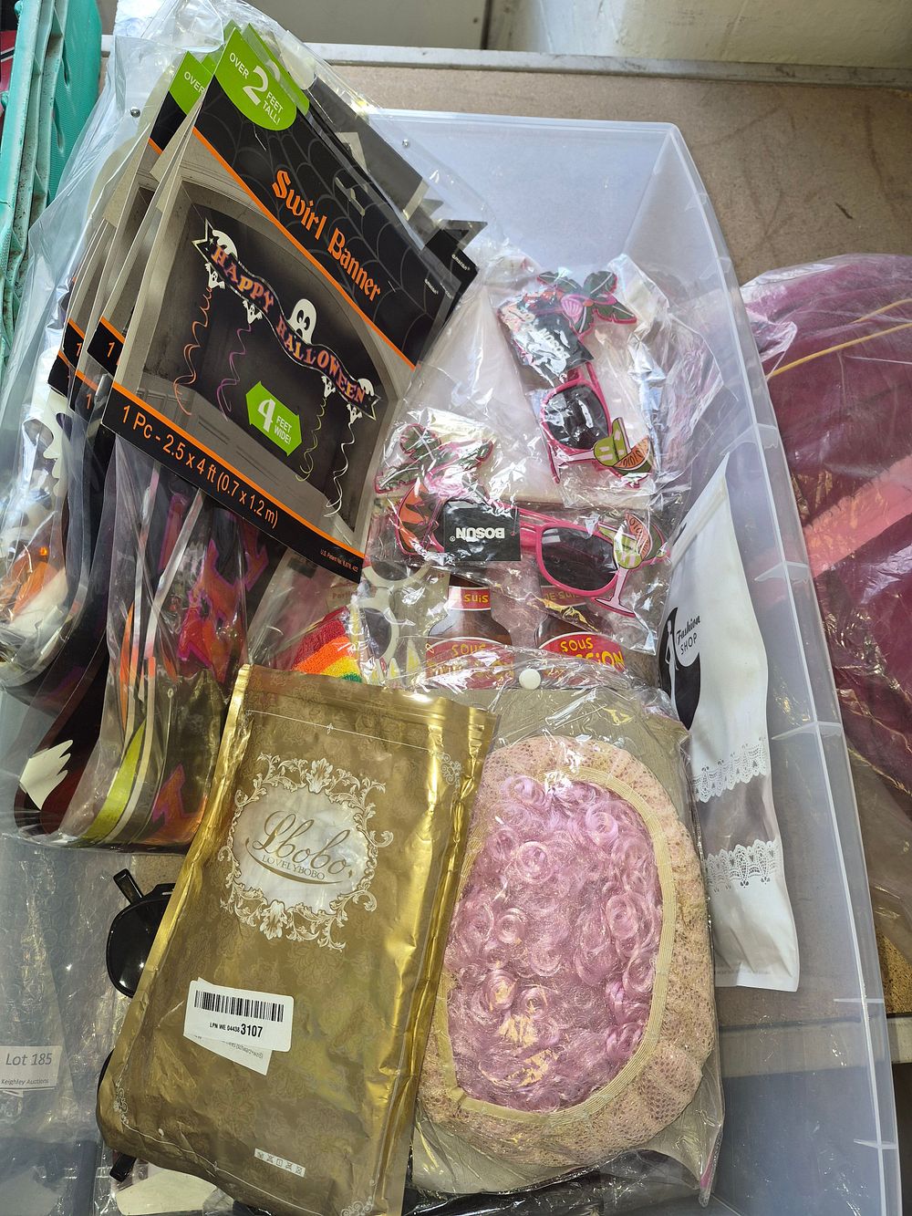 Lot 186 – An Assortment of Party Supplies and Novelties Including Amscan Halloween Banners and Lovelybobo Wig