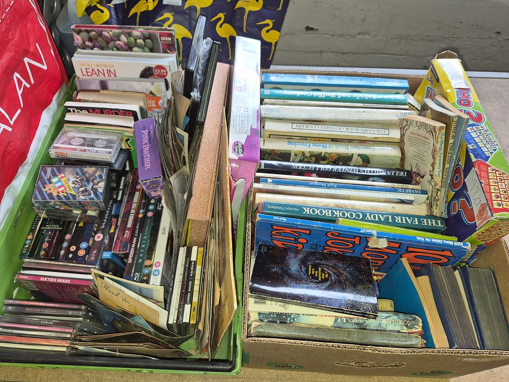 Lot 196 – Two Boxes of Mixed Media and Books Including Delia Smith, Enid Blyton, and The Matrix Blu-ray Titles