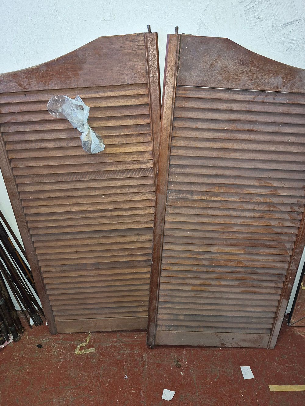 Lot 205 – A Pair of Stained Wood Louvered Saloon Swing Doors with fixings