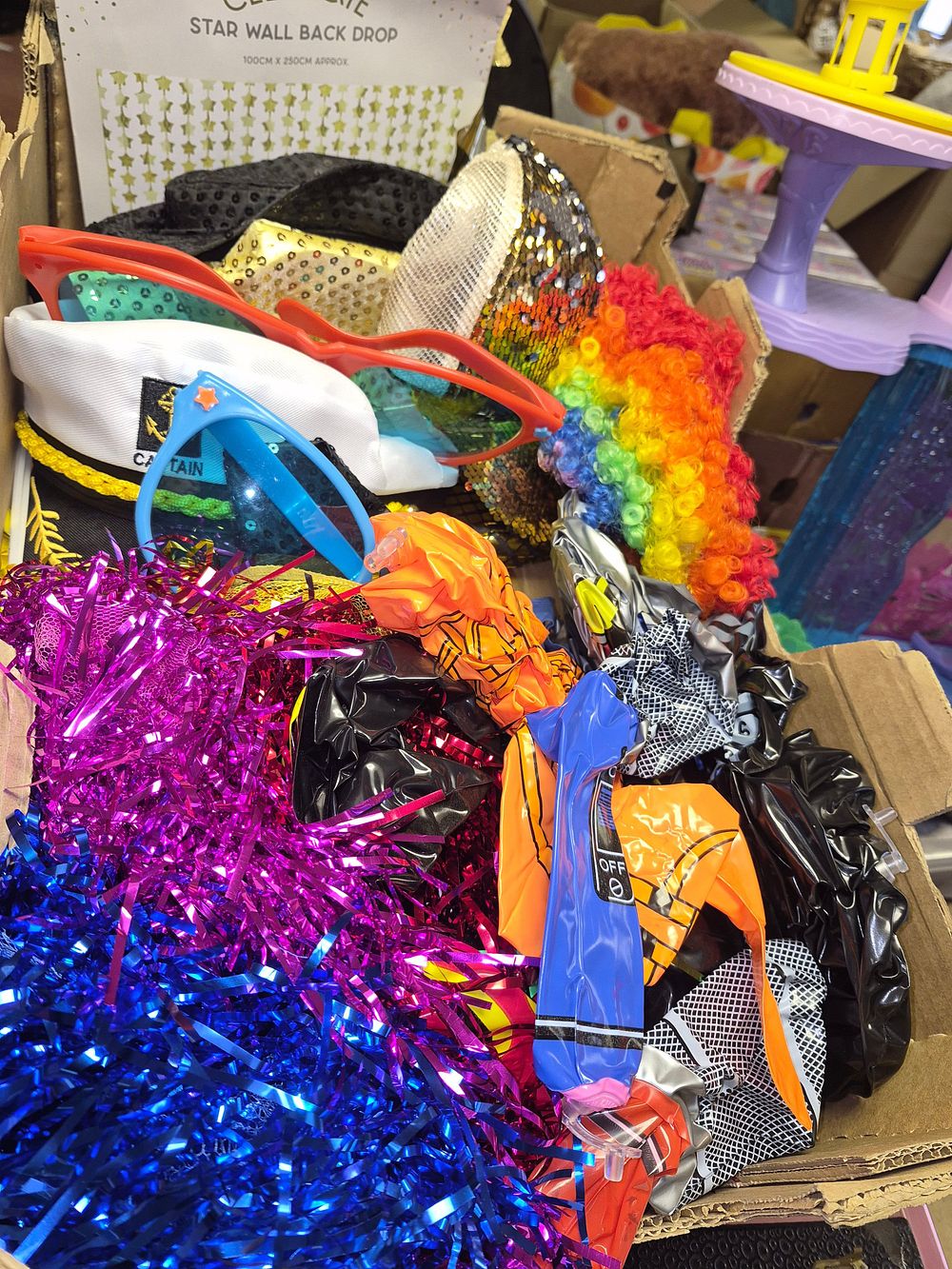 Lot 85 – An Assortment of Fancy Dress Accessories and Party Decorations Including Inflatables