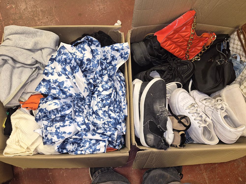 Lot 107 – Two Boxes of Fashion Clothing, Footwear, and Accessories Including Prada and AF1