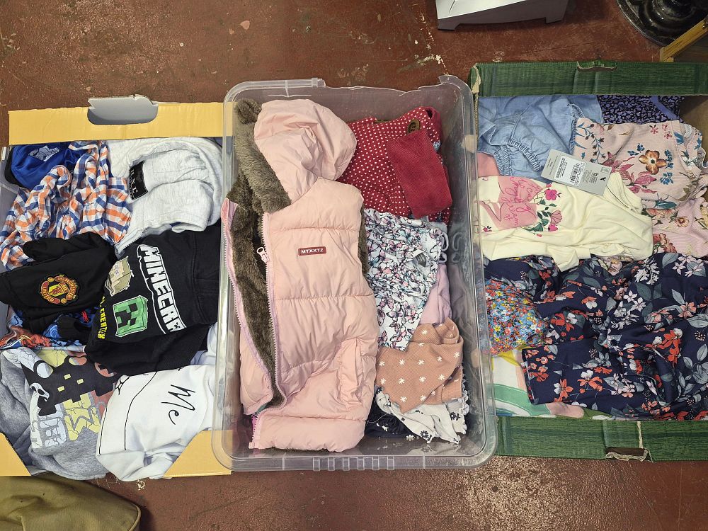 Lot 113 – Three Boxes of Children’s Clothing Including Minecraft and Manchester United Items some with tags