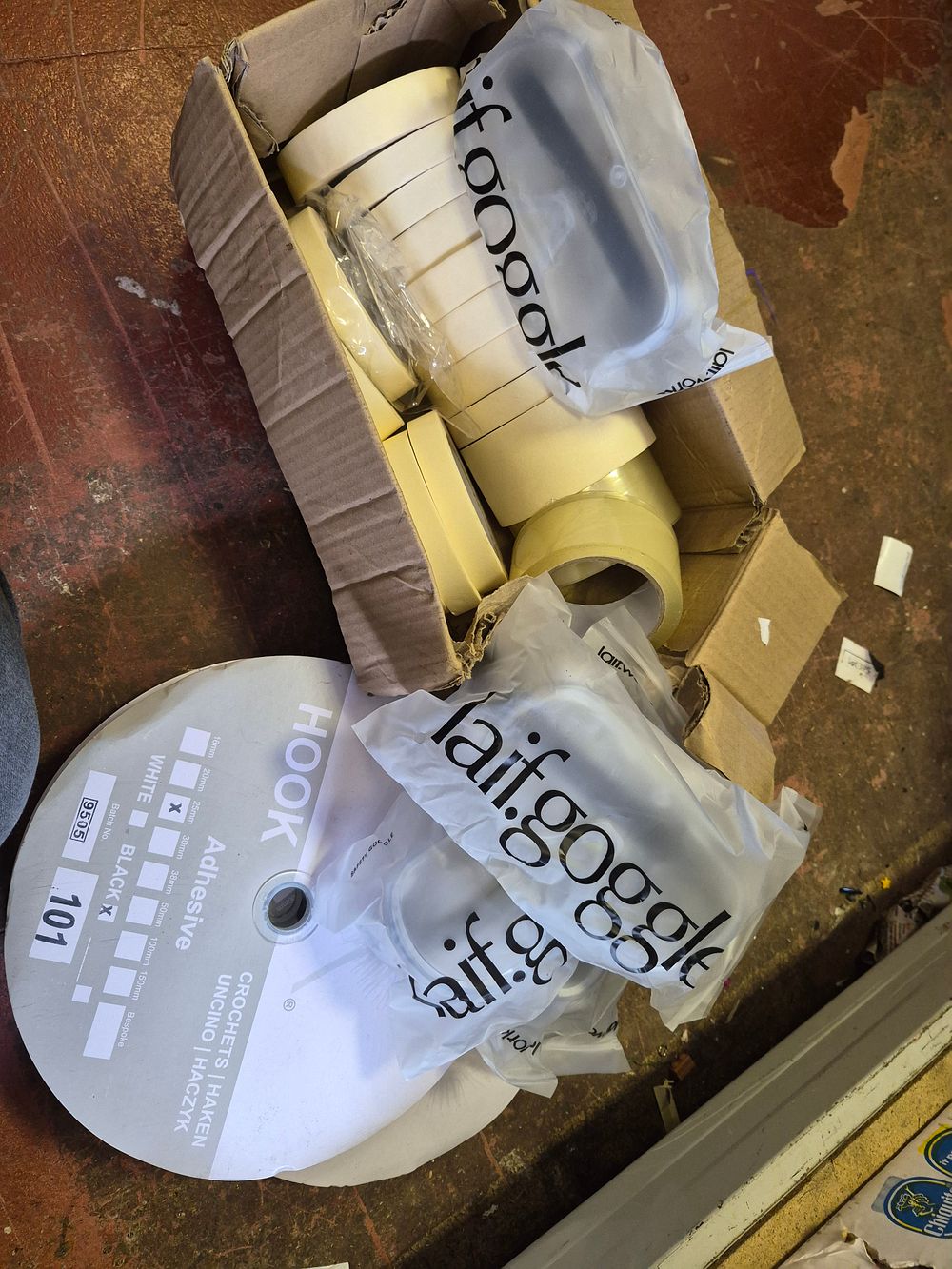 Lot 70 – An Assortment of Adhesive Tapes, Laifgoggle Safety Goggles, and Hook-and-Loop Fastening Material