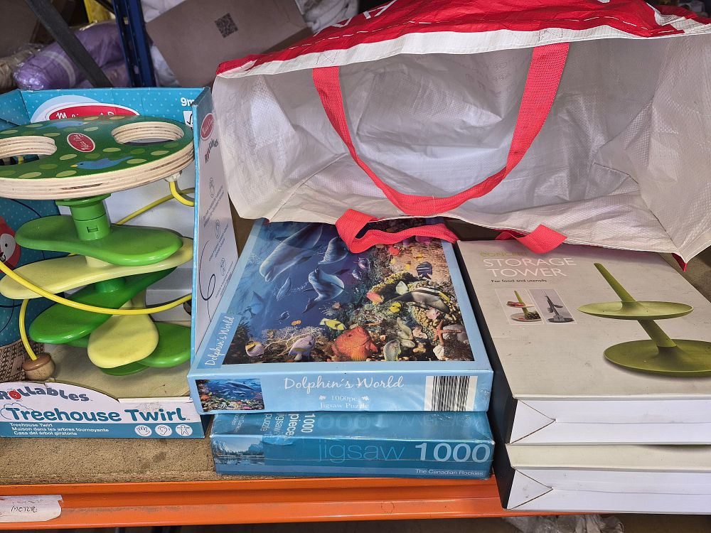 Lot 82 – A Collection of New Toys and Household Items Including Melissa & Doug Treehouse Twirl and 1000 Piece Jigsaw Puzzles