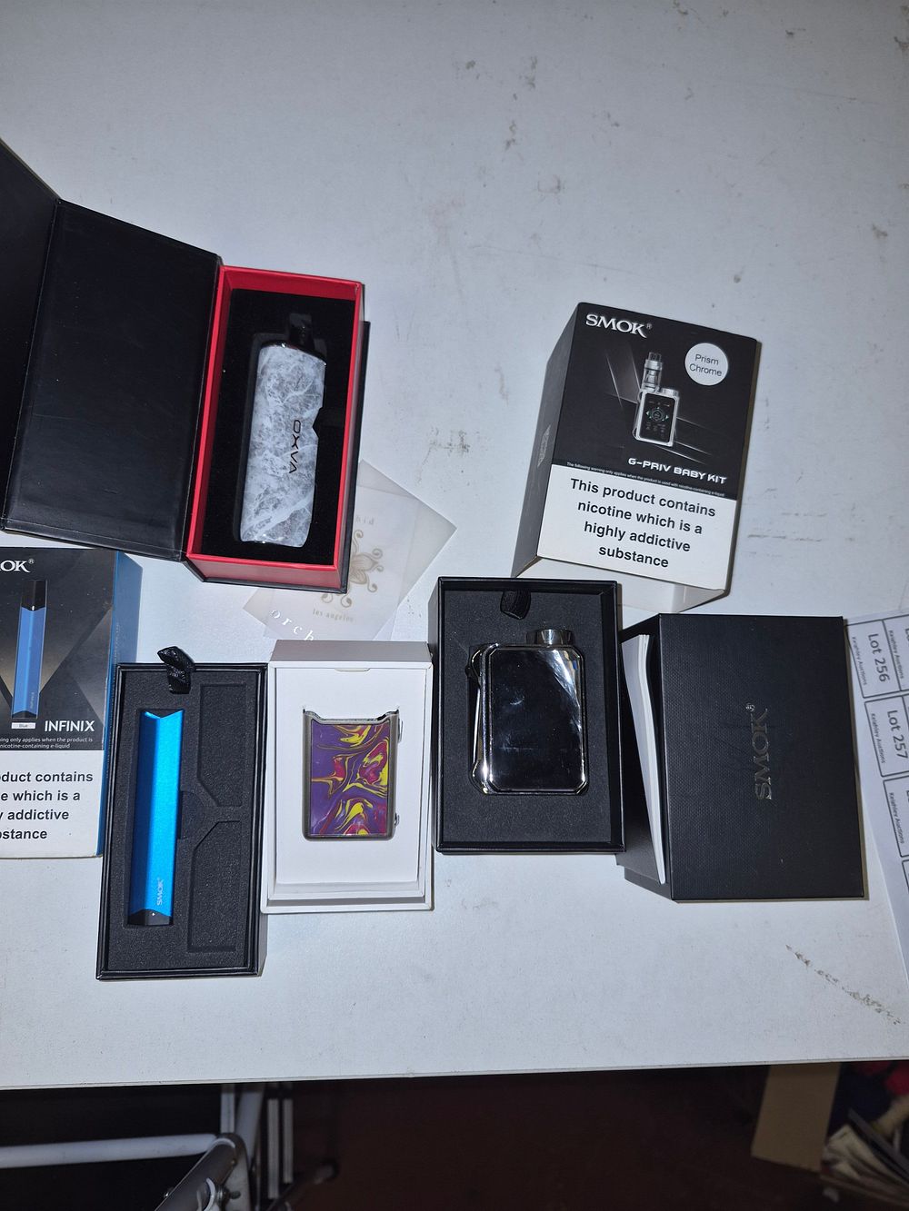Lot 232 – A Collection of SMOK and OXVA Electronic Cigarette Devices and Kits