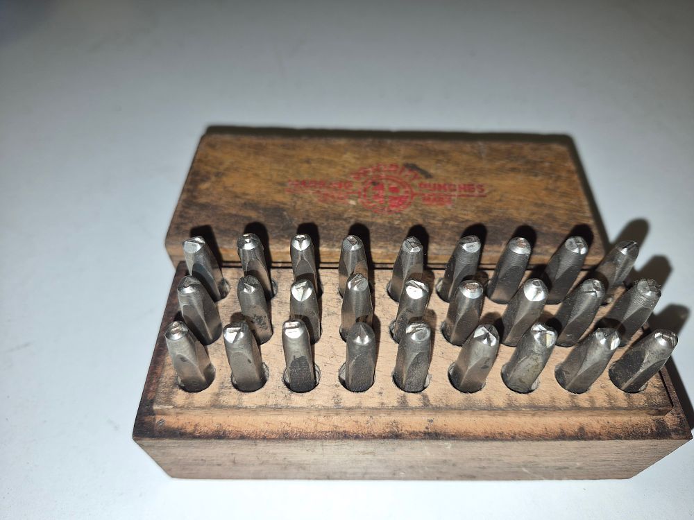 Lot 234 – A Priority Letter Punch Set in branded wooden box