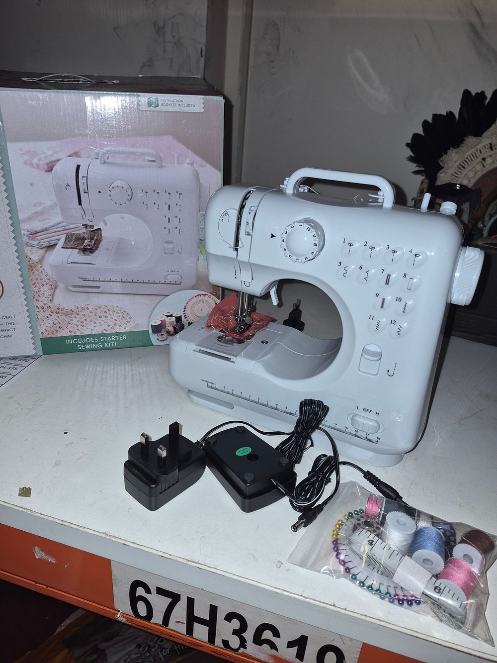 Lot 261 – FHSM-505 Compact Electric Sewing Machine with Starter Kit and box powers on