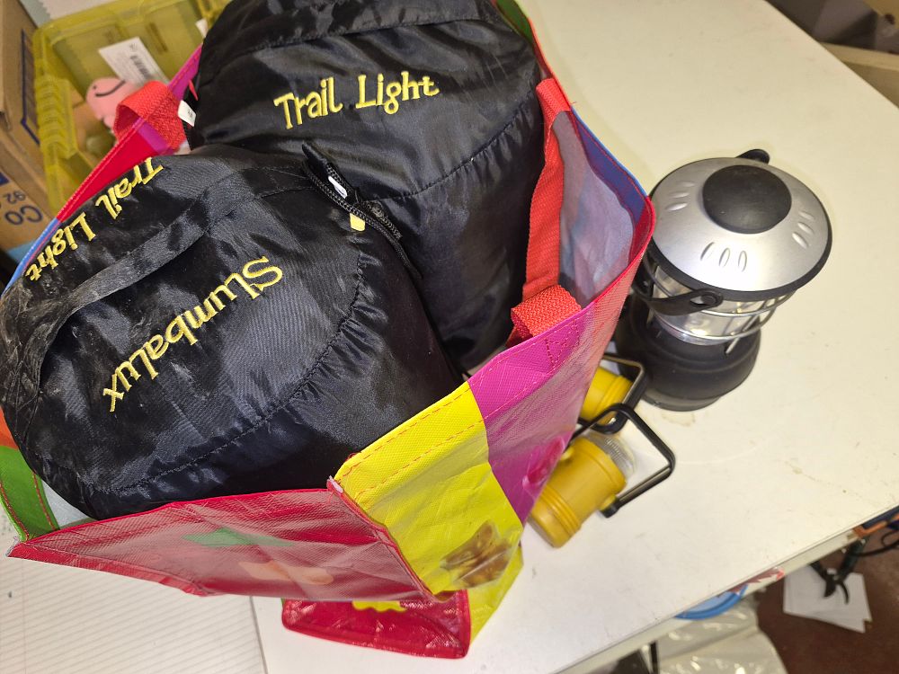 Lot 266 – Pair of Slumbalux Trail Light Sleeping Bags and Three Battery Powered Lanterns