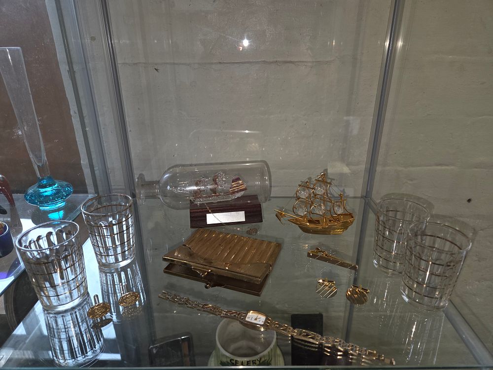 Lot 633 – An Assortment of Vintage Gilt Glassware, Dress Accessories and Maritime Miniatures