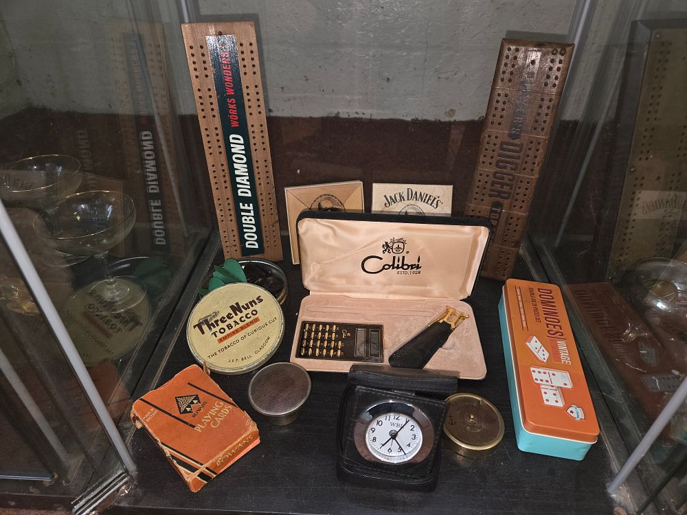Lot 639 – A Collection of Vintage Men’s Leisure and Smoking Accessories Including Colibri, Jack Daniel’s, and Double Diamond
