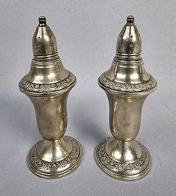 A Pair of A.M.C. Weighted Sterling Silver Shakers Shakers weigh 338 Grams Total 
5.5 inches 