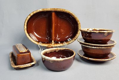 A Collection of Hull 'Brown Drip' and 'Crestone' Dinnerware with a McCoy Handled Bowl. A 