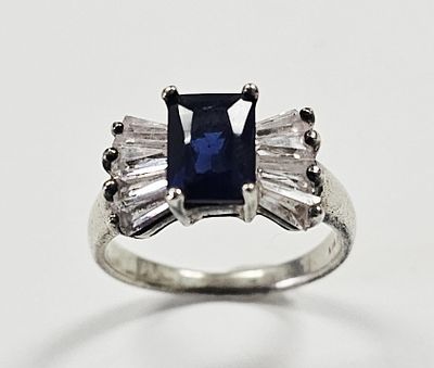 Sterling Silver Sapphire & Crystal Ring. Ring is size 7.5 Ring weighs 3.9 Grams
