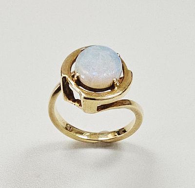 Modernist 14-Karat Yellow Gold and Opal Ring. A modernist ring crafted in 14-karat yellow gold 