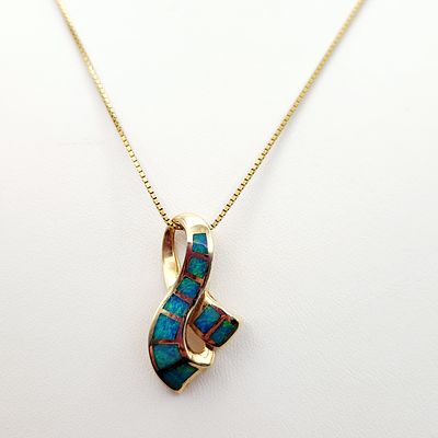 14K Gold Opal Pendant Necklace 9.6 Grams. A 14K yellow gold necklace featuring a modern 