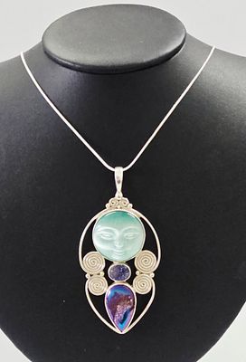 A Sajen Sterling Silver and Multi-Stone Moon Face Pendant Necklace. A sterling silver necklace 