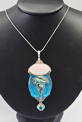 A Sajen Sterling Silver Multi-Media Dolphin Motif Pendant Necklace. A contemporary sterling 