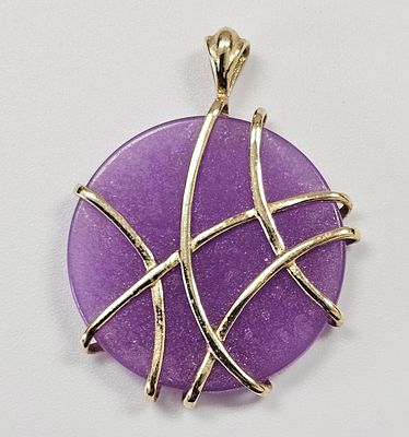 10k Yellow Gold and Purple Stone Wire-Wrapped Pendant. This circular pendant features a flat 